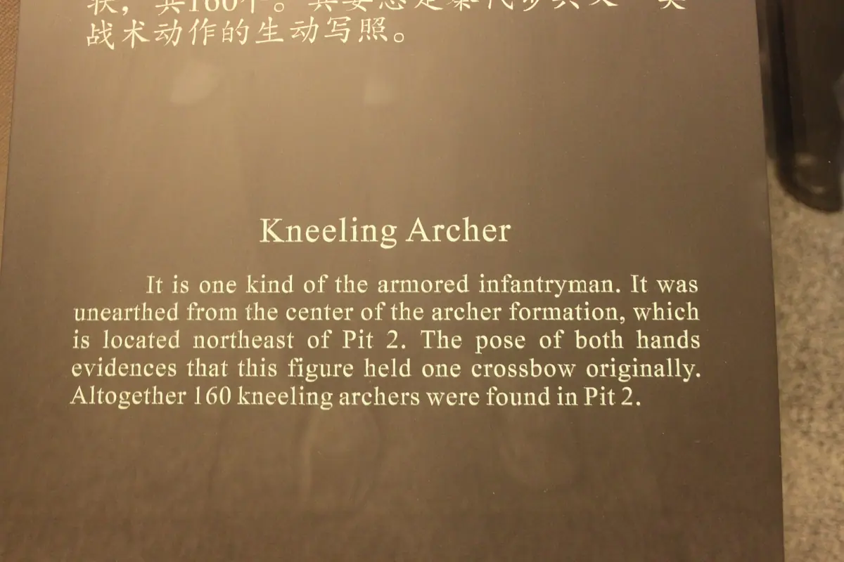 The kneeling archer figure